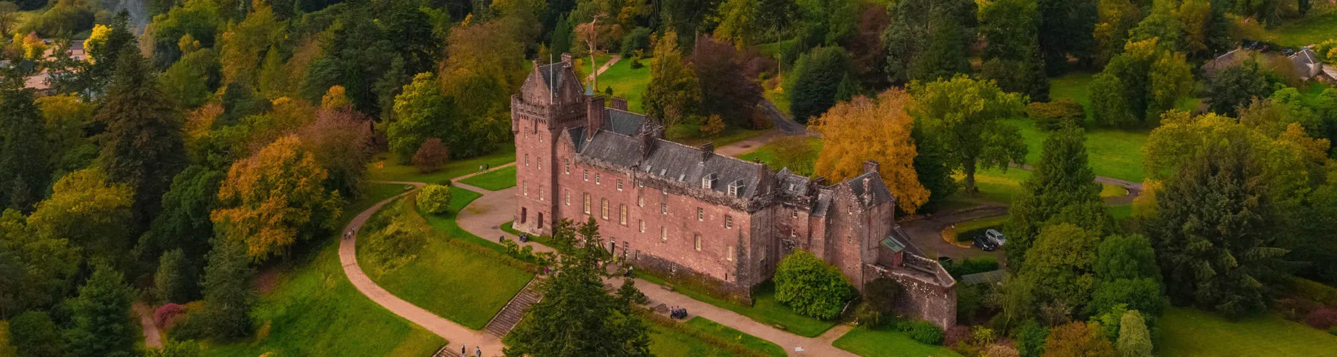 Brodick castle ariel view surrounded in woodland